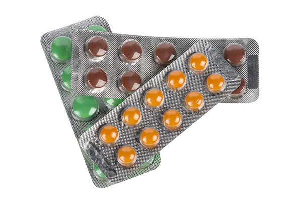 Stapel verschiedener Pillen in Blasen isoliert auf weißem Hintergrund — Stockfoto