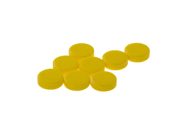 白い背景の上の黄色い丸薬の矢印 — ストック写真