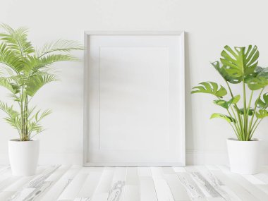 Beyaz çerçeve, iç kısımda, bitkilerin maketi ile birlikte yere dayanıyor. 3 boyutlu bir resimde çerçevelenmiş bir resmin şablonu