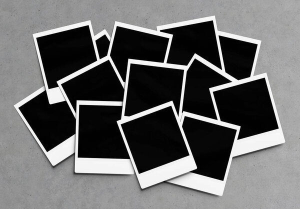 Stack of instant photos Mockup. Pile of retro photographs on concrete surface 3D rendering