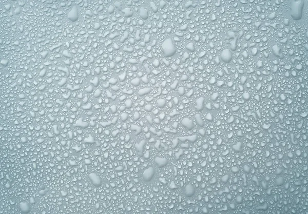 Blaue Tröpfchen Wasser Hintergrund Regentapete Mit Flüssigkeitstropfen lizenzfreie Stockfotos