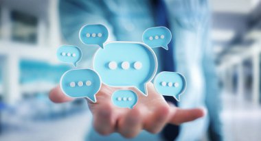 Dijital mavi konuşma baloncukları kullanan bir iş adamı ikonlar hakkında konuşur. Kullanıcı elinde asgari sohbet ya da sosyal medya mesajları yüzüyor. 3B görüntüleme