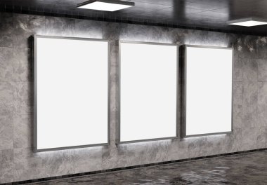 Yeraltı metro duvarında üç tane dikey reklam panosu var. Üç boyutlu reklam tablosu, tren istasyonunun iç mekânına istifçilik.