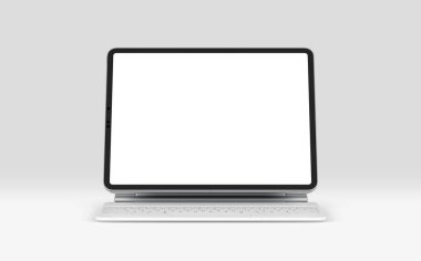 PARIS - Fransa - 28 Nisan 2022: Beyaz sihirli klavyeli Apple Ipad Pro Silver rengi, Gri arkaplanda ön ekran tableti modeli