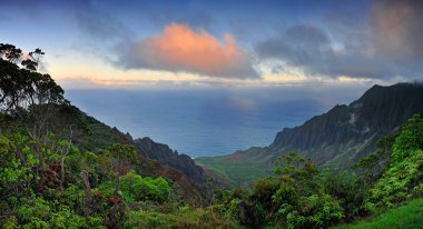 Mist rising from the valley of Kalalau at sunrise, in Kauai, Haw clipart