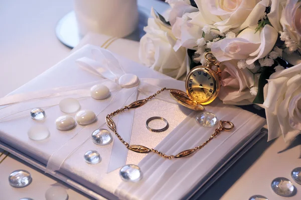 Old gold pocket watch in the sunlight at a wedding — Stock Photo, Image