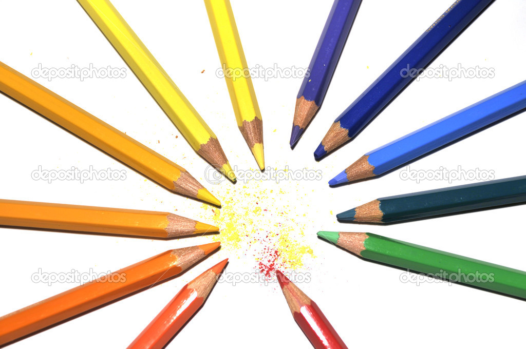 Color crayons in a circle with powder scrubbing, on white