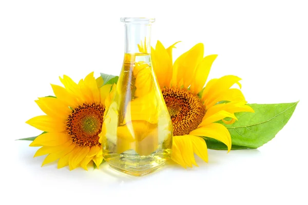 Sunflower oil with sunflowers on white background — Stock Photo, Image