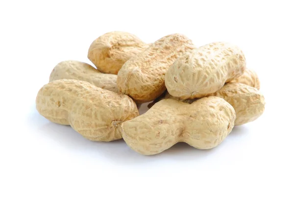 Composition from peanuts on the white background — Stock Photo, Image