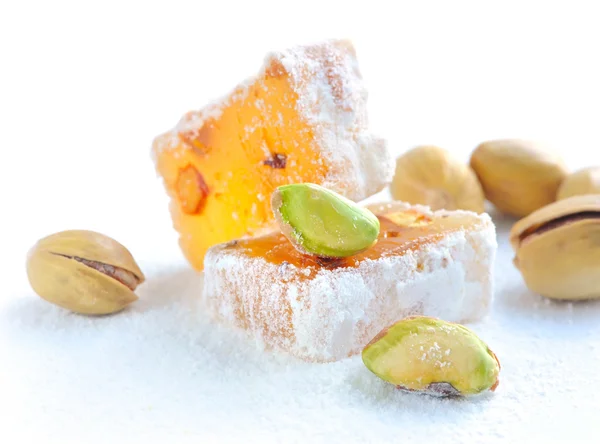 Turkish delight (lokum) with pistachios on a white background, closeup — Stock Photo, Image