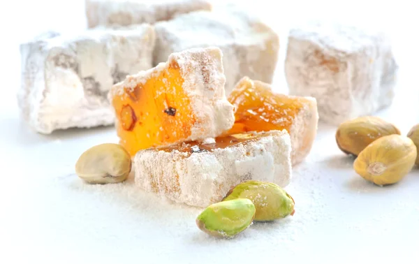 Turkish delight (lokum) with pistachios on a white background, closeup — Stock Photo, Image