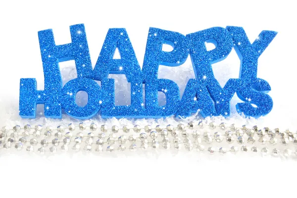 Inscription of happy holidays is on snow on a white background — Stock Photo, Image