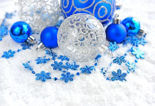 Christmas blue and silver decorations on snow — Stock Photo, Image