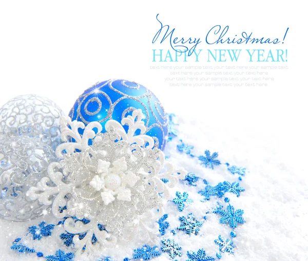 Christmas blue and silver decorations on snow with sample text — Stock Photo, Image