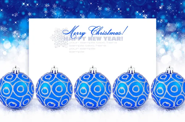 Blue christmas balls with snow on a festive background with space for text — Stock Photo, Image