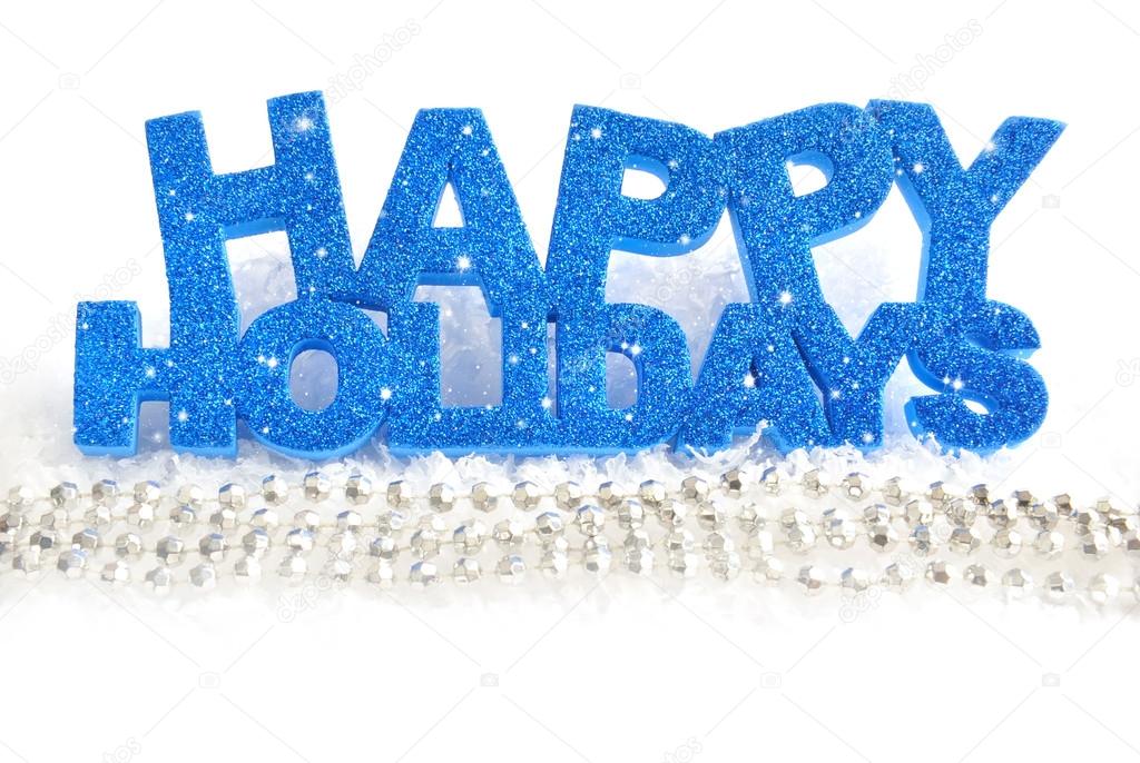 Inscription of happy holidays is on snow on a white background