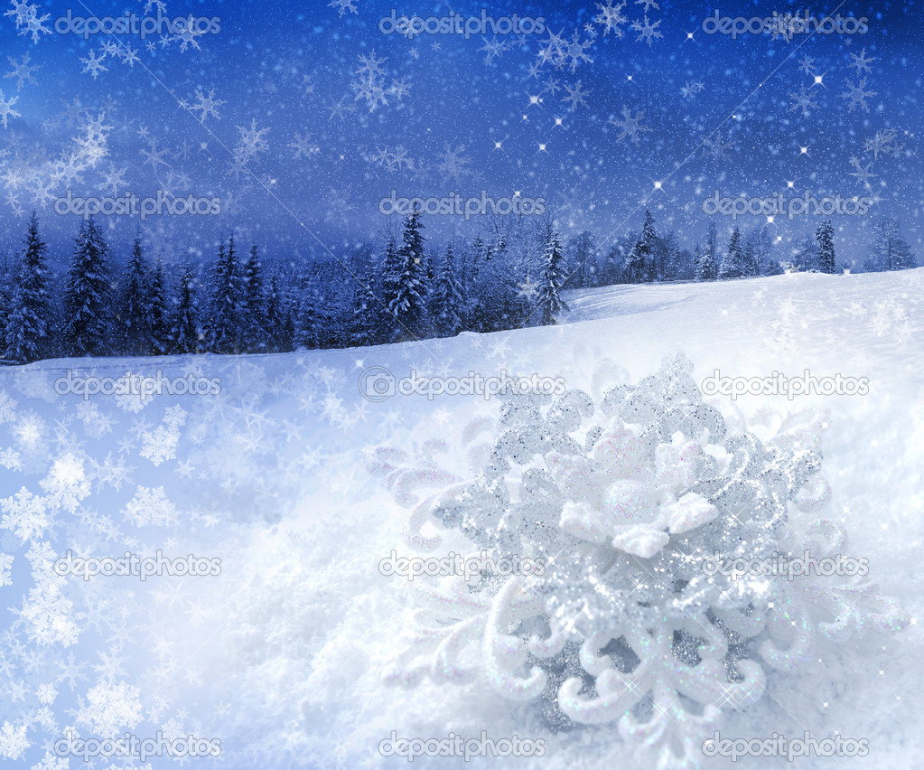 Christmas snowflake on a background a winter landscape