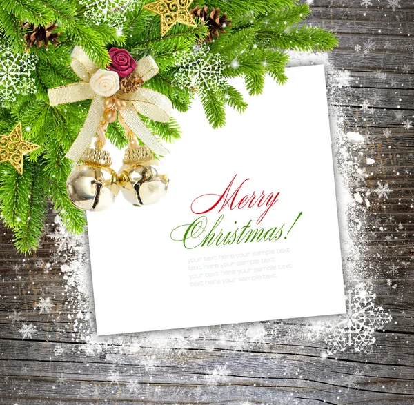 Christmas composition is on the sheet of paper on a winter wooden background — Stock Photo, Image