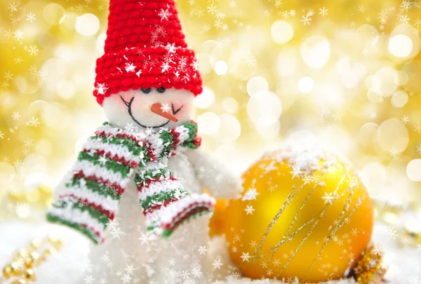 Snowman with Christmas decorations on a festive background — Stock Photo, Image
