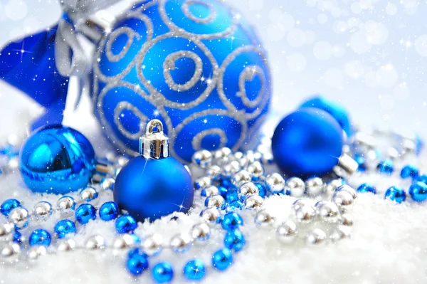 Christmas blue and silver decorations on snow — Stock Photo, Image