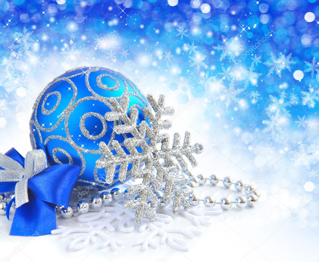 Christmas blue ball is with baubles on festive background