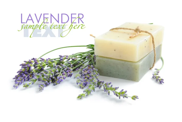 Handmade soap and lavender flowers on a white background — Stock Photo, Image