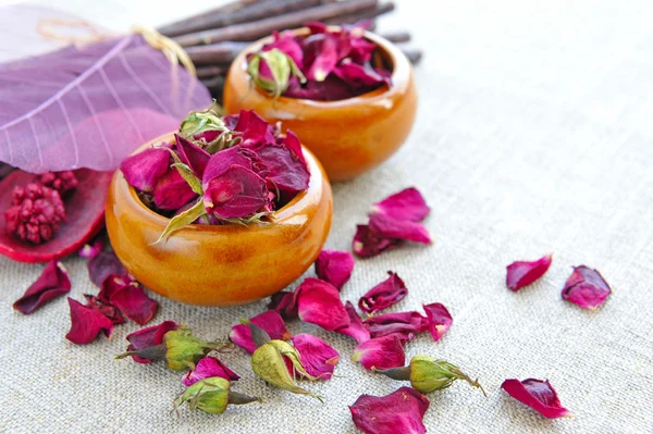 Dry healing flowers and petals in a cups on sackcloth, herbal medicine — Stock Photo, Image