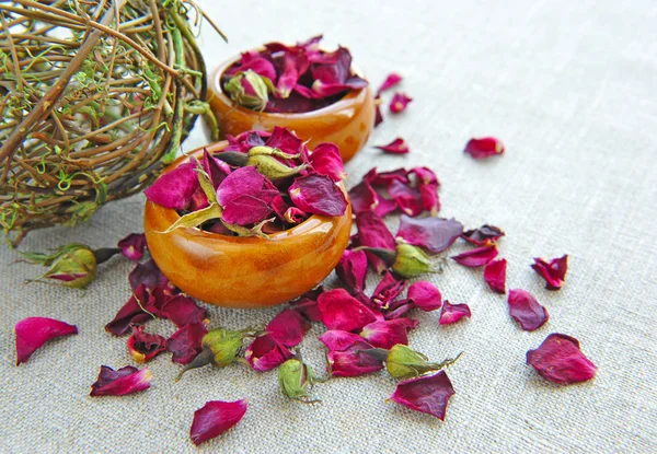 Dry healing flowers and petals in a cups on sackcloth, herbal medicine — Stock Photo, Image