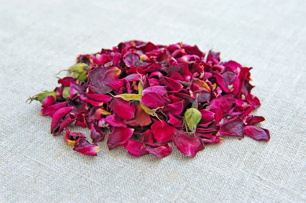 Dry healing flowers and petals on sackcloth, herbal medicine — Stock Photo, Image