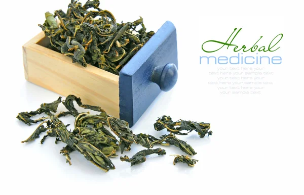 Dry herbal tea in a little box on a white background — Stock Photo, Image