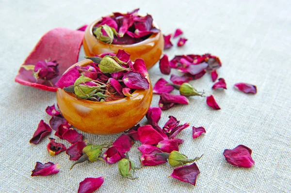 Dry healing flowers and petals in a cups on sackcloth, herbal medicine — Stock Photo, Image