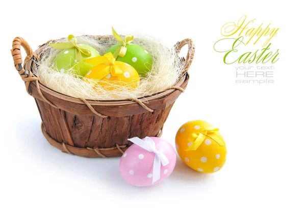 Easter eggs are in a trug on a white background — Stock Photo, Image