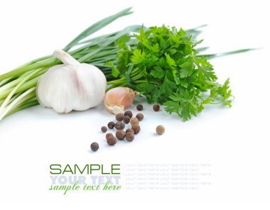 Grains of pepper are with a garlic and greenery of parsley on a white background clipart