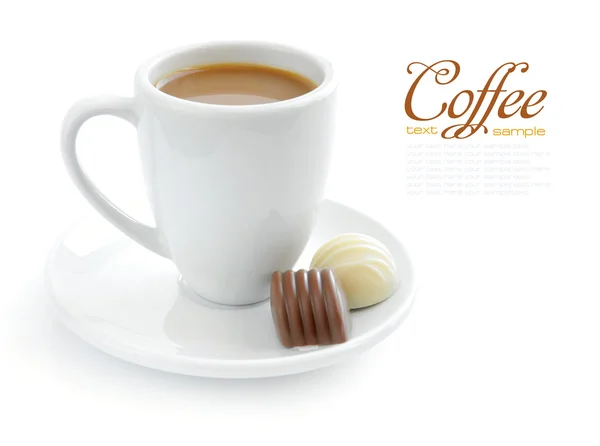 Cup of coffee with candies on white background — Stock Photo, Image