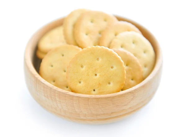 Crackers in a wooden bowl on white background — Stock Photo, Image