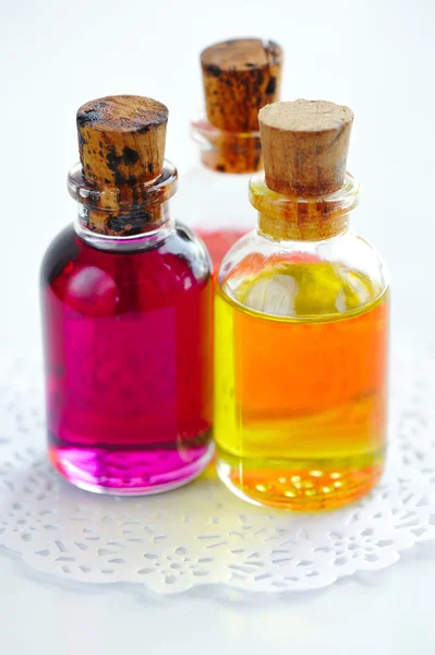 Bottles with basics oils on white — Stock Photo, Image