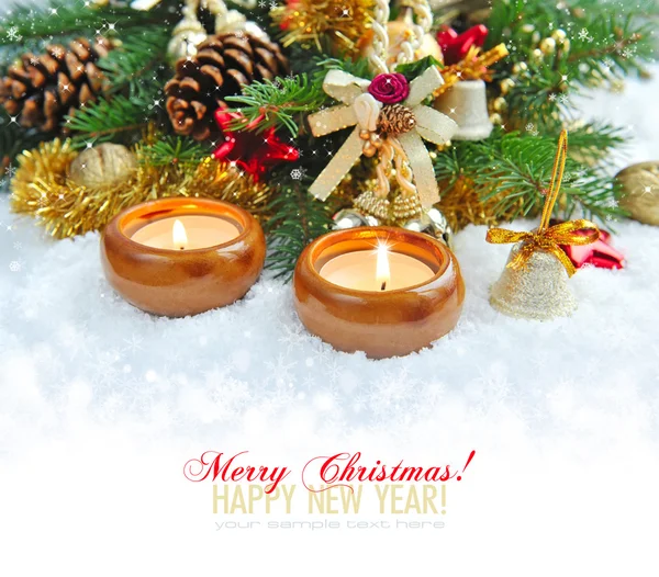 Christmas composition is with candles on snow — Stock Photo, Image