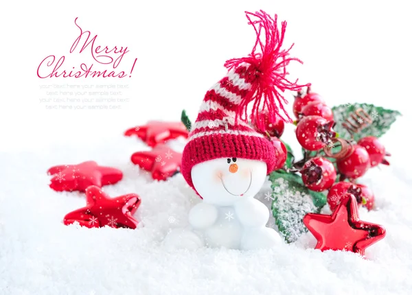 Snowman with Christmas decorations on snow — Stock Photo, Image