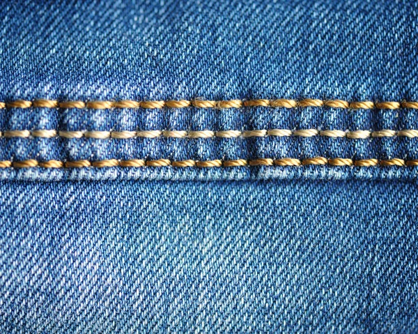 Texture of blue jeans. Close-up — Stock Photo, Image
