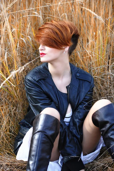 Beautiful sensual girl posing in the grass — Stock Photo, Image