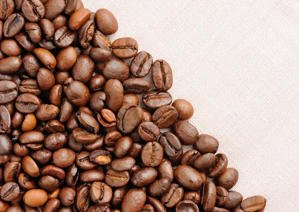 Coffee beans on linen background — Stock Photo, Image