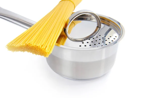 Bunch of spaghetti and pan on a white background — Stock Photo, Image