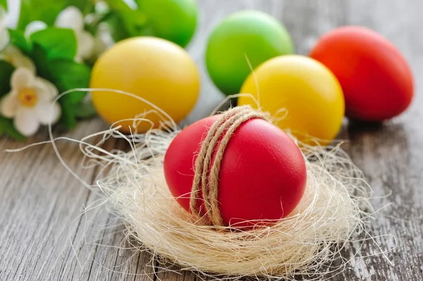 Colorful Easter eggs on a wooden table old — Stock Photo, Image