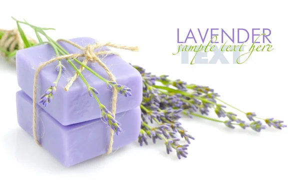 Handmade soap and lavender flowers on a white background — Stock Photo, Image