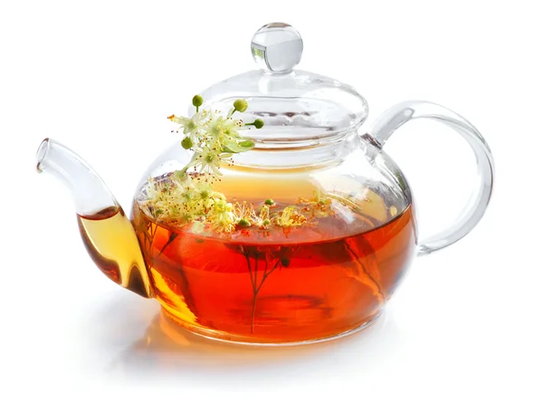 Teapot with linden tea and flowers on white background — Stock Photo, Image
