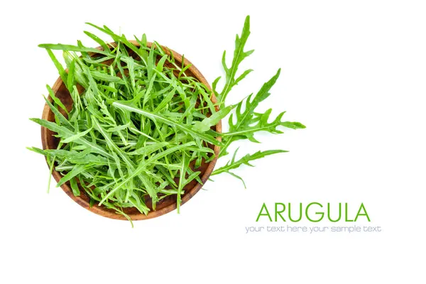 テキストのコピースペースを持つ白い背景に隔離されたボウルに新鮮なArugula トップ表示 — ストック写真