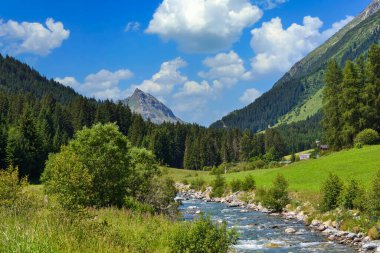 Summer mountain landscape and blue sky with clouds. Location place Alps, Europe.