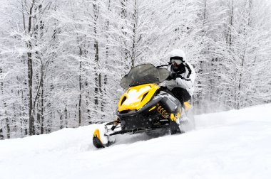 Man on snowmobile clipart