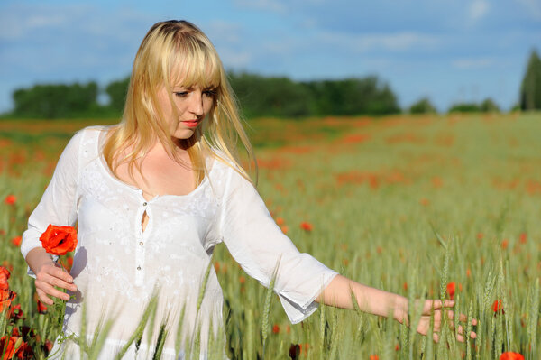 Young beautiful girl in the field