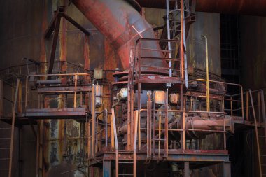 Detail of blast furnaces, rusty metal at abandoned factory